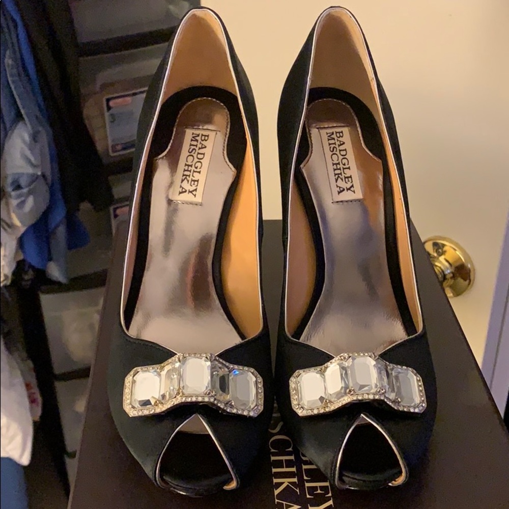 Badgley Mischka black pumps with diamond jewel.